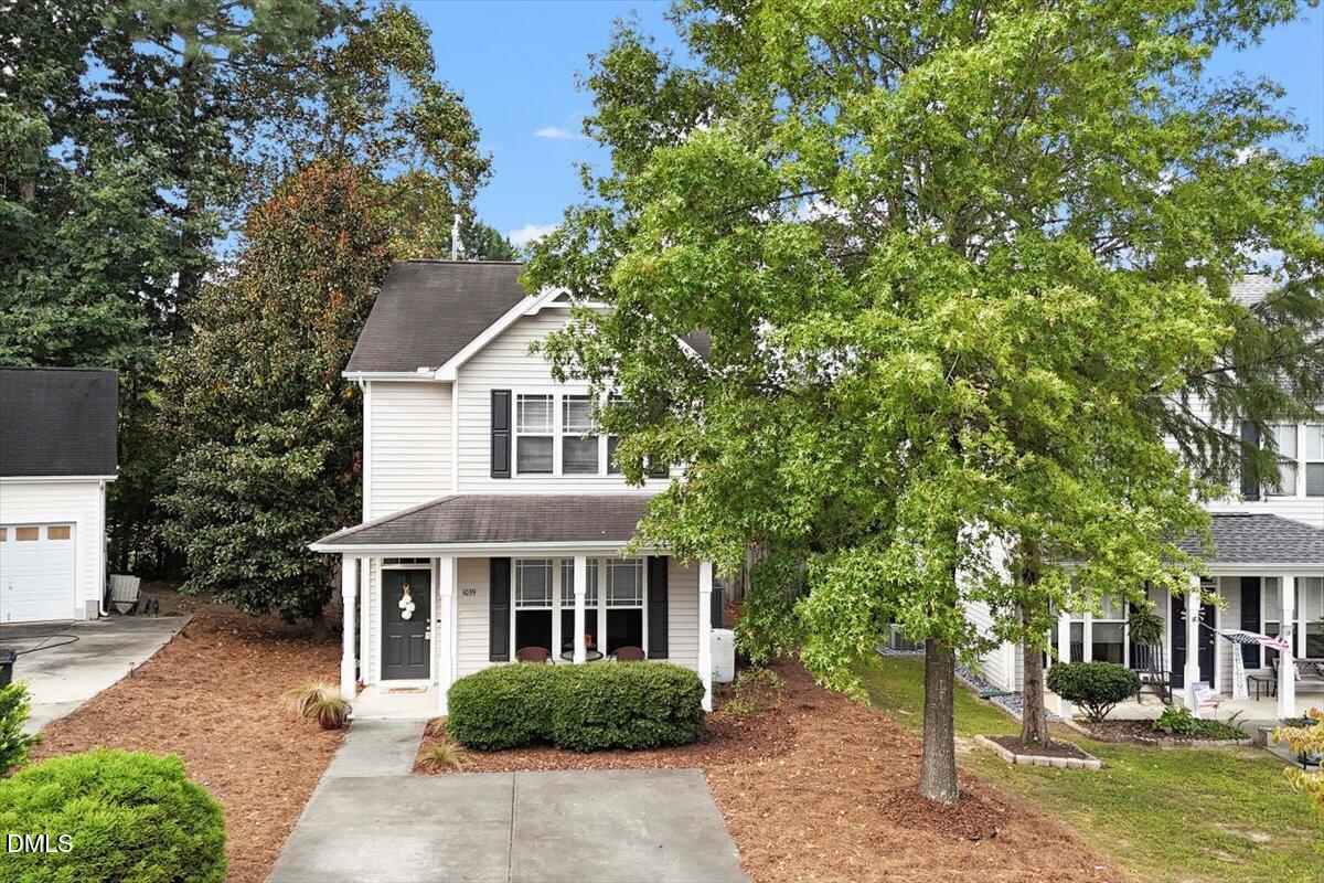 1039 Dual Parks Road Apex, NC 27502 - Photo 36 of 46 a front view of a house with a yard