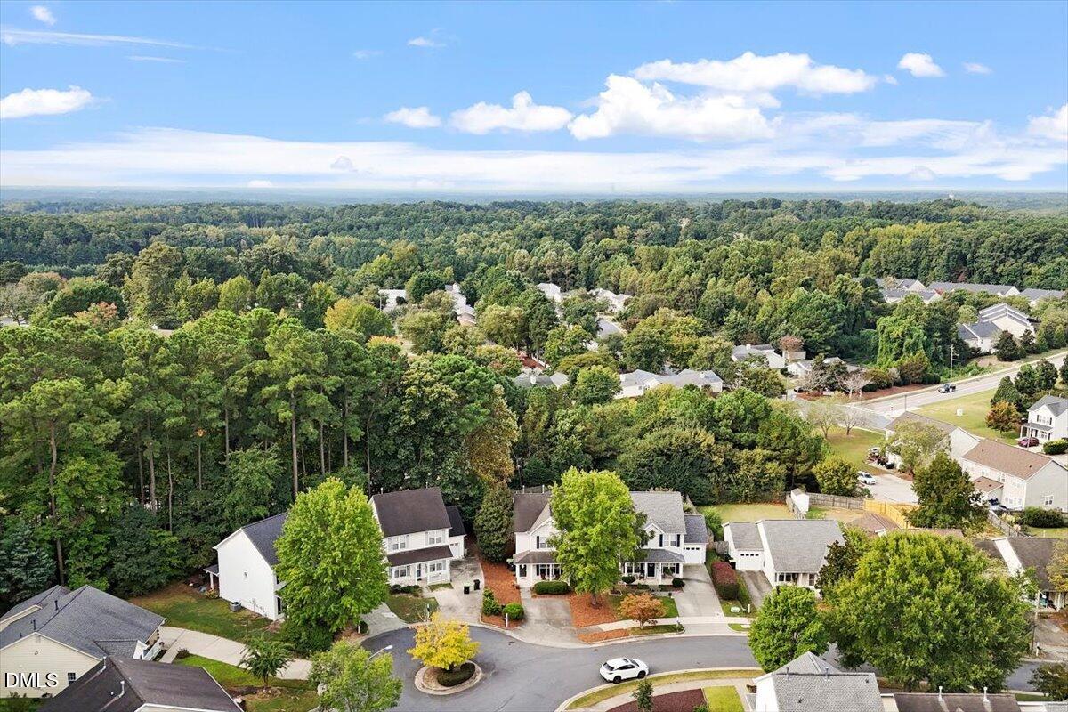 1039 Dual Parks Road Apex, NC 27502 - Photo 39 of 46 an aerial view of residential houses with outdoor space and trees