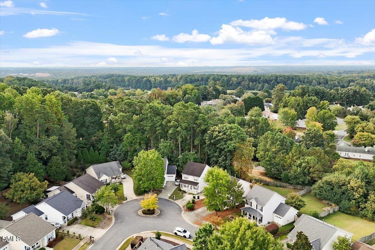 1039 Dual Parks Road Apex, NC 27502 - Photo 40 of 46 an aerial view of a house with lots of trees