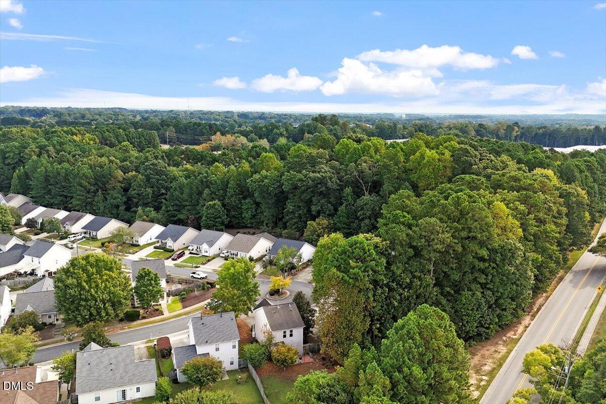 1039 Dual Parks Road Apex, NC 27502 - Photo 42 of 46 an aerial view of residential houses with outdoor space and trees