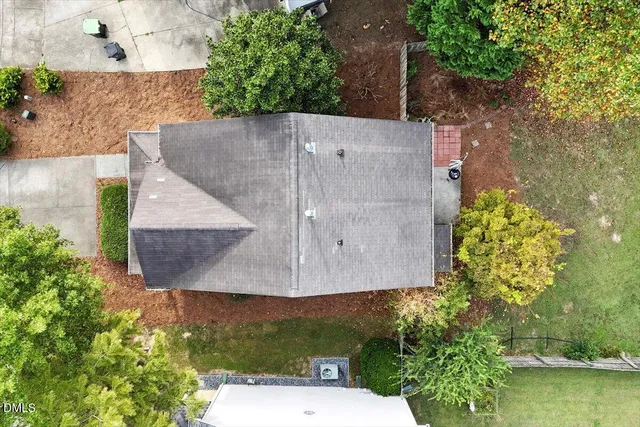 an aerial view of a house with outdoor space