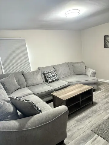 a living room with furniture and a couch