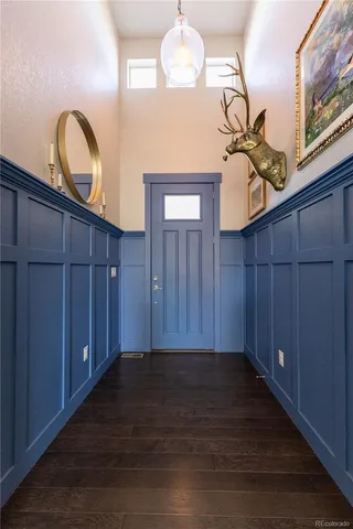 a view of a room with wooden floor and window