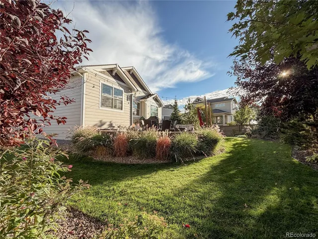 a backyard of a house with lots of green space