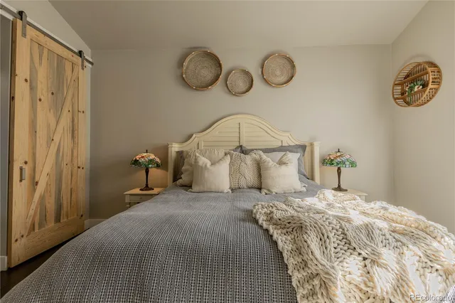 a bedroom with a bed and a table in it