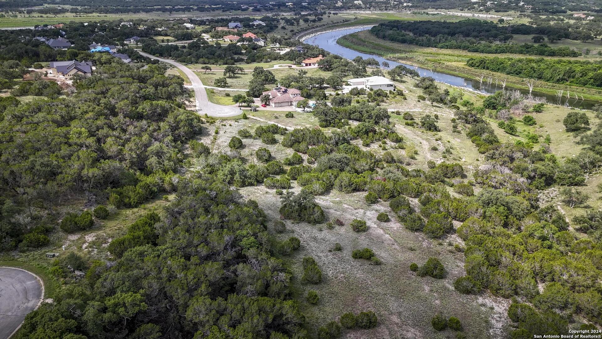 228 Enigma Avenue Spring Branch, TX 78070 - Photo 19 of 39 an aerial view of residential houses with outdoor space and trees