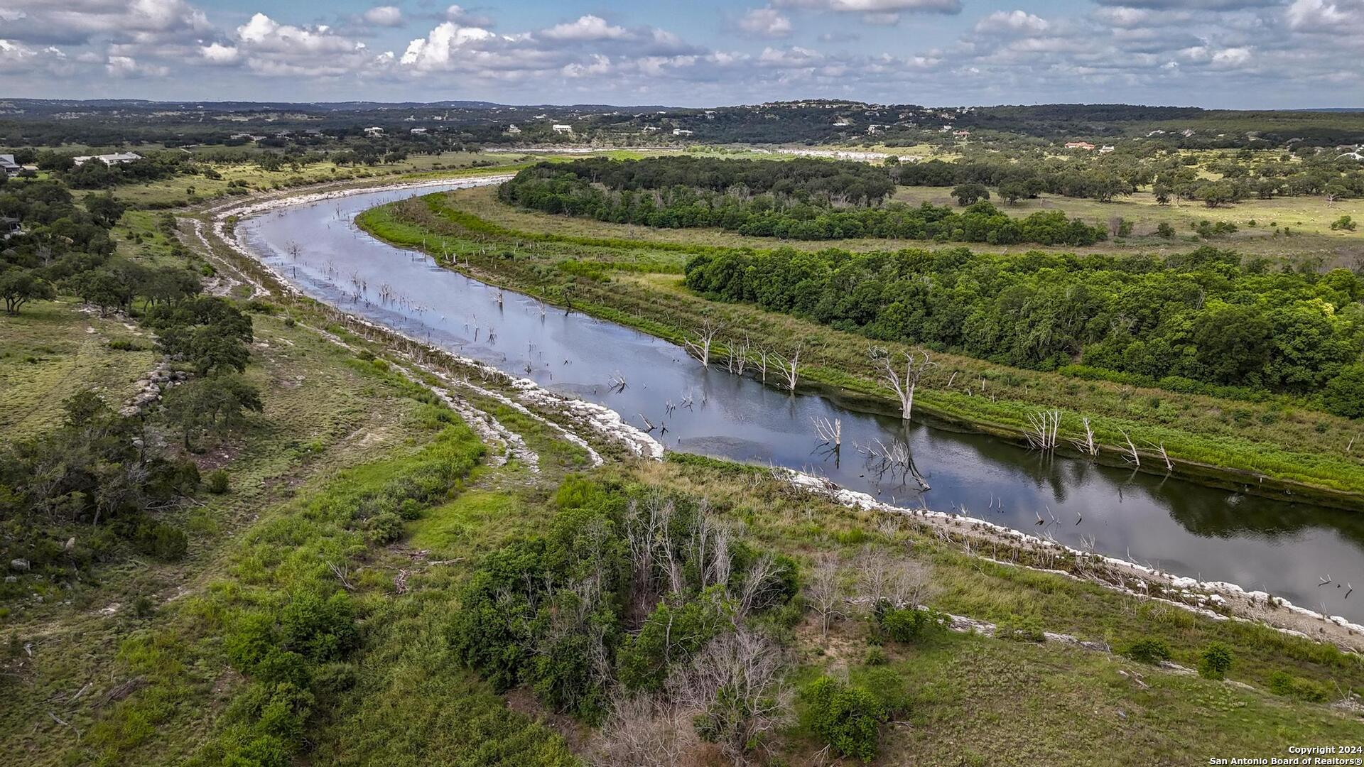 228 Enigma Avenue Spring Branch, TX 78070 - Photo 3 of 39 a view of a lake with a city