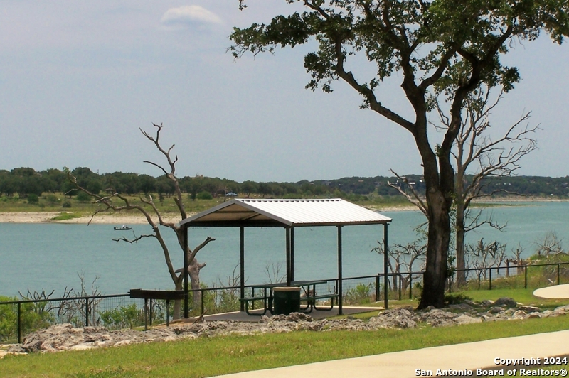 228 Enigma Avenue Spring Branch, TX 78070 - Photo 32 of 39 a backyard of a house with table and chairs