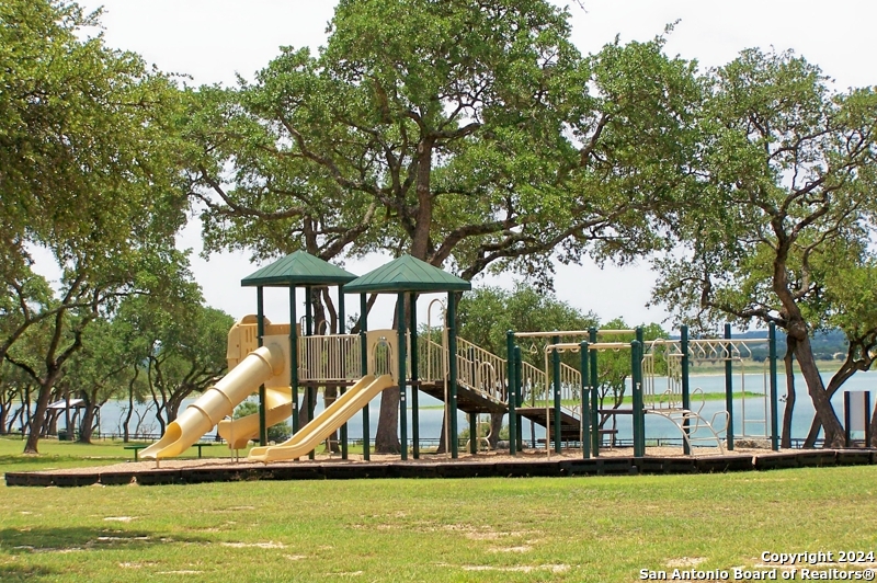 228 Enigma Avenue Spring Branch, TX 78070 - Photo 33 of 39 a view of a swimming pool with an outdoor seating