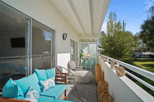 a view of a balcony with chairs