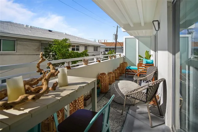 a kitchen with stainless steel appliances kitchen island granite countertop a table and chairs
