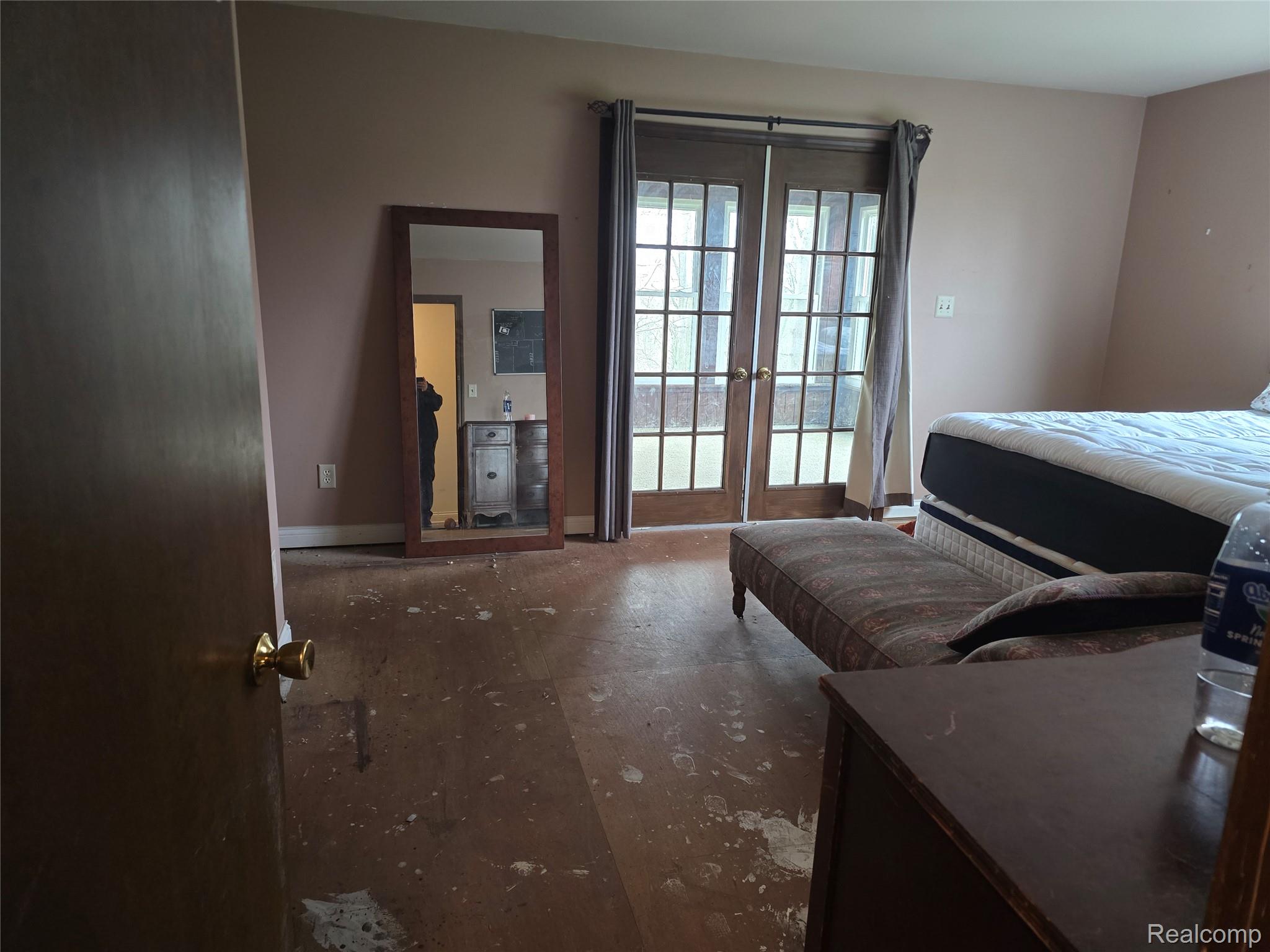 12012 Belle River Road Memphis, MI 48041 - Photo 14 of 41 Bedroom featuring french doors and baseboards