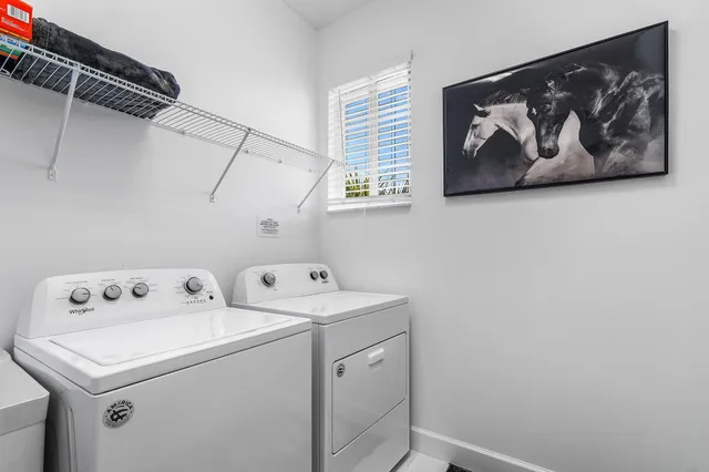 a utility room with dryer and washer