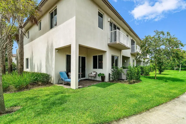a front view of a house with a yard and porch