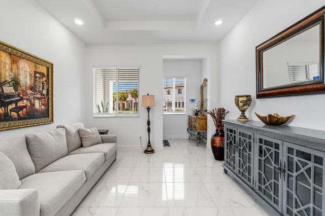 a bedroom with furniture and wooden floor