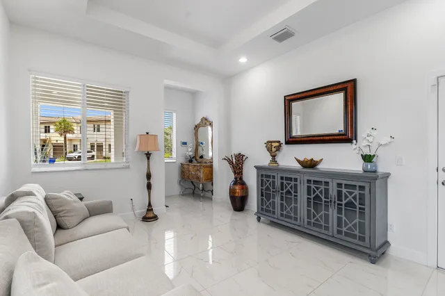 a view of a livingroom with furniture and windows