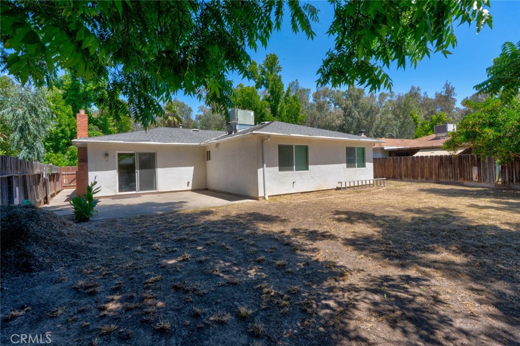 1840 Cheyenne Drive Merced, CA 95348 - Photo 74 of 90 a front view of house with yard and trees around