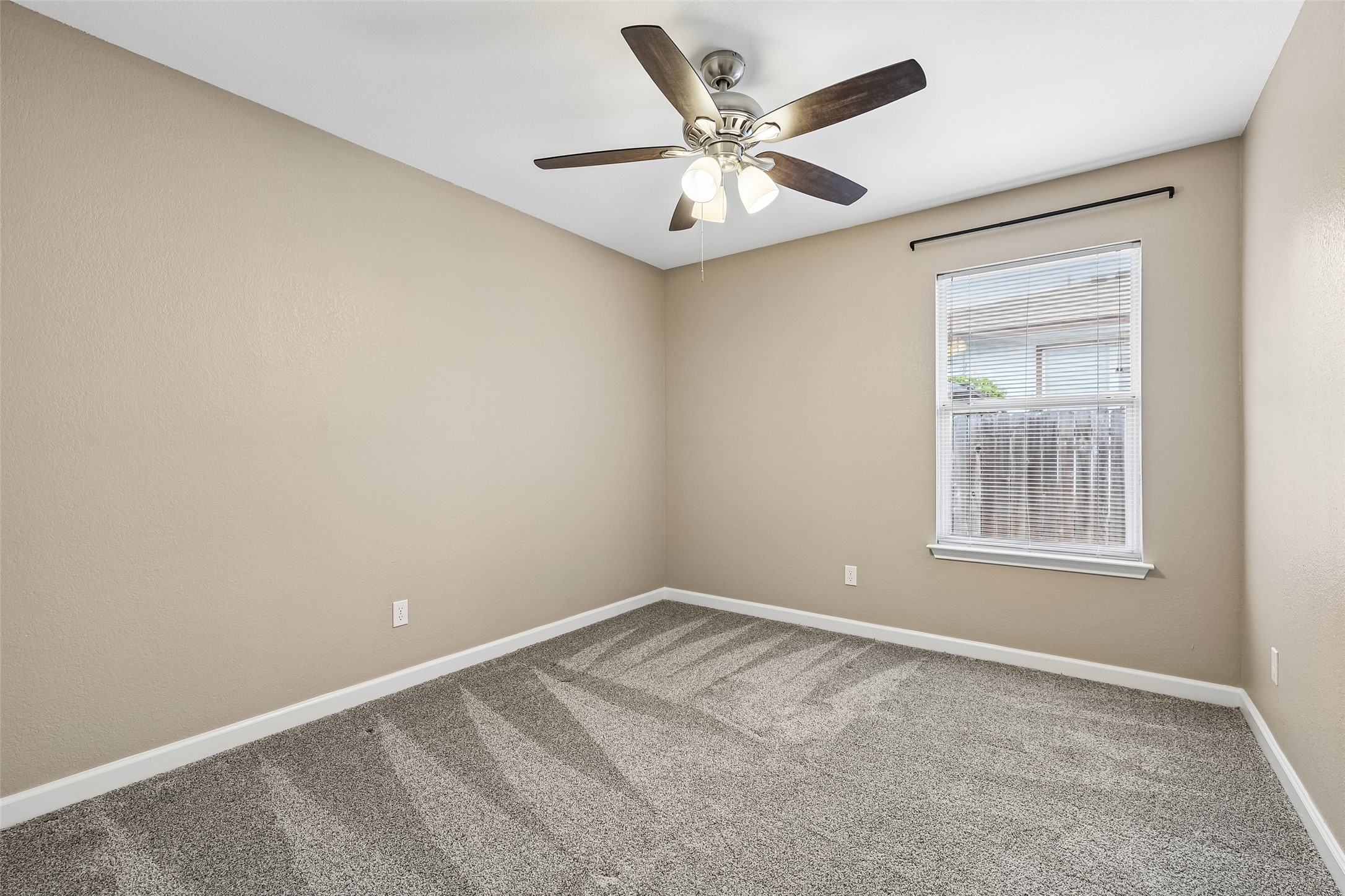 152 Grant Way Kyle, TX 78640 - Photo 32 of 39 an empty room with a window