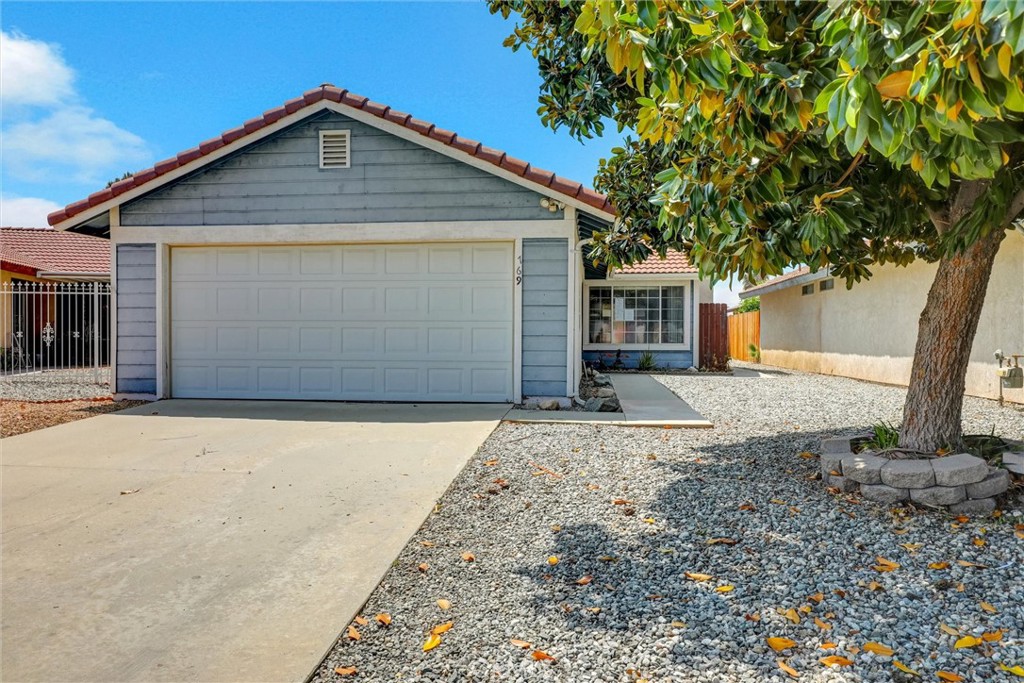 769 Don Drive Hemet, CA 92543 - Photo 2 of 27 a front view of a house with a yard and garage