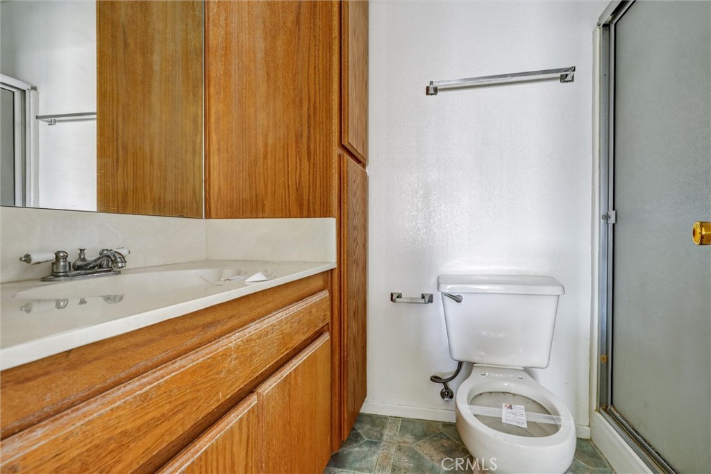 769 Don Drive Hemet, CA 92543 - Photo 21 of 27 a bathroom with a sink a toilet and shower