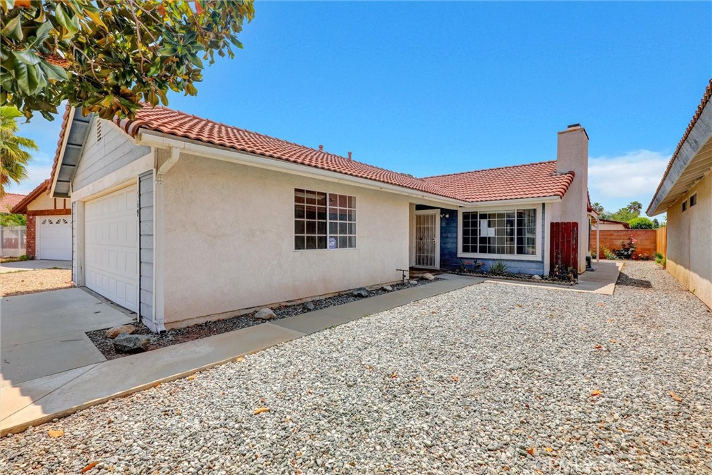 769 Don Drive Hemet, CA 92543 - Photo 4 of 27 a front view of a house with a yard