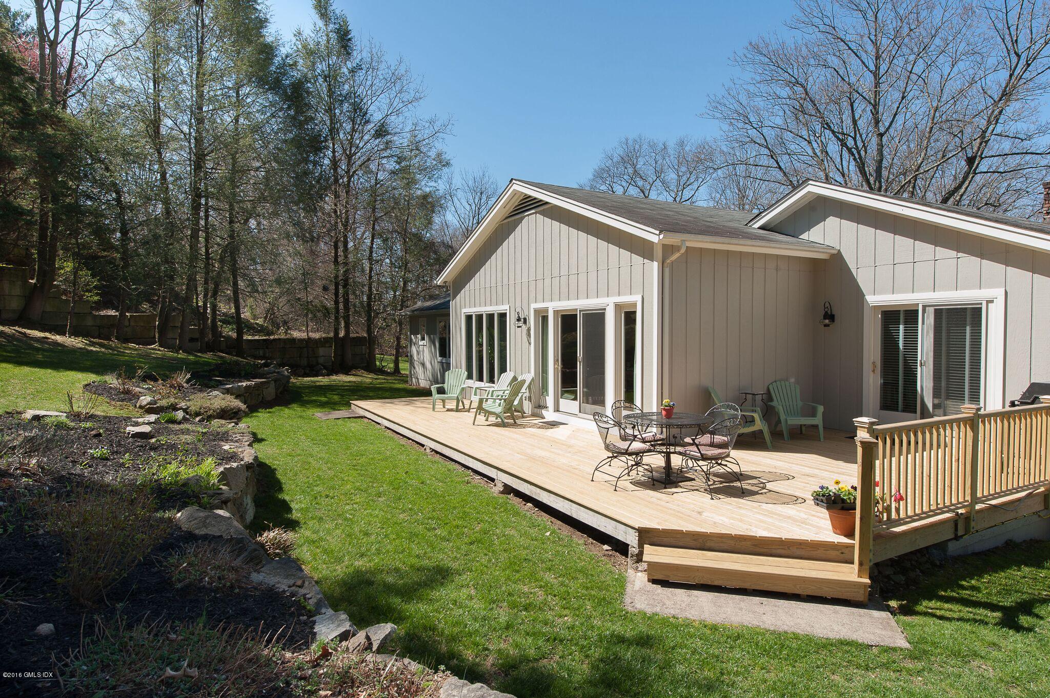 57 Long Meadow Road Riverside, CT 06878 - Photo 8 of 18 a view of a house with backyard and sitting area
