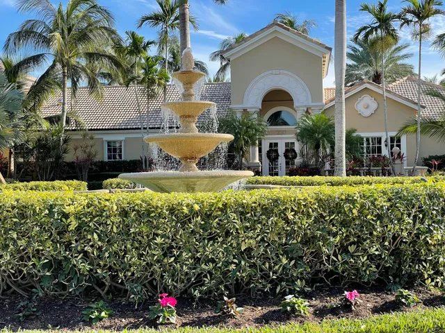 a view of a house with swimming pool and a yard