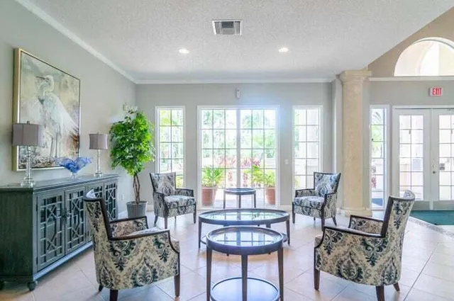 a living room with furniture and a large window