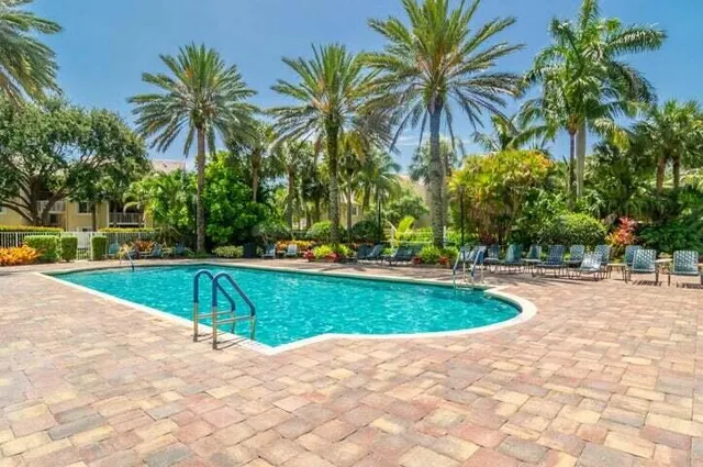 a view of a house with backyard sitting area and garden