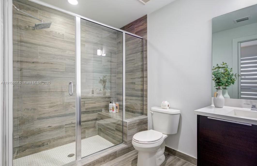 2955 Bird Avenue, Unit PHA Miami, FL 33133 - Photo 16 of 24 a bathroom with a shower and a toilet