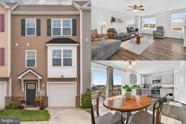 a view of a dining room and livingroom with furniture wooden floor and a rug