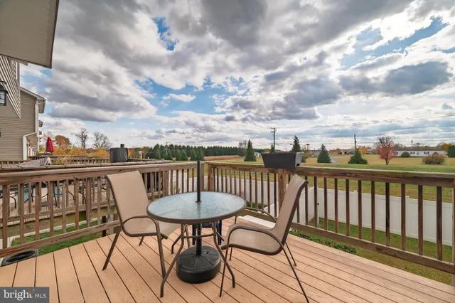 a view of a balcony with chairs