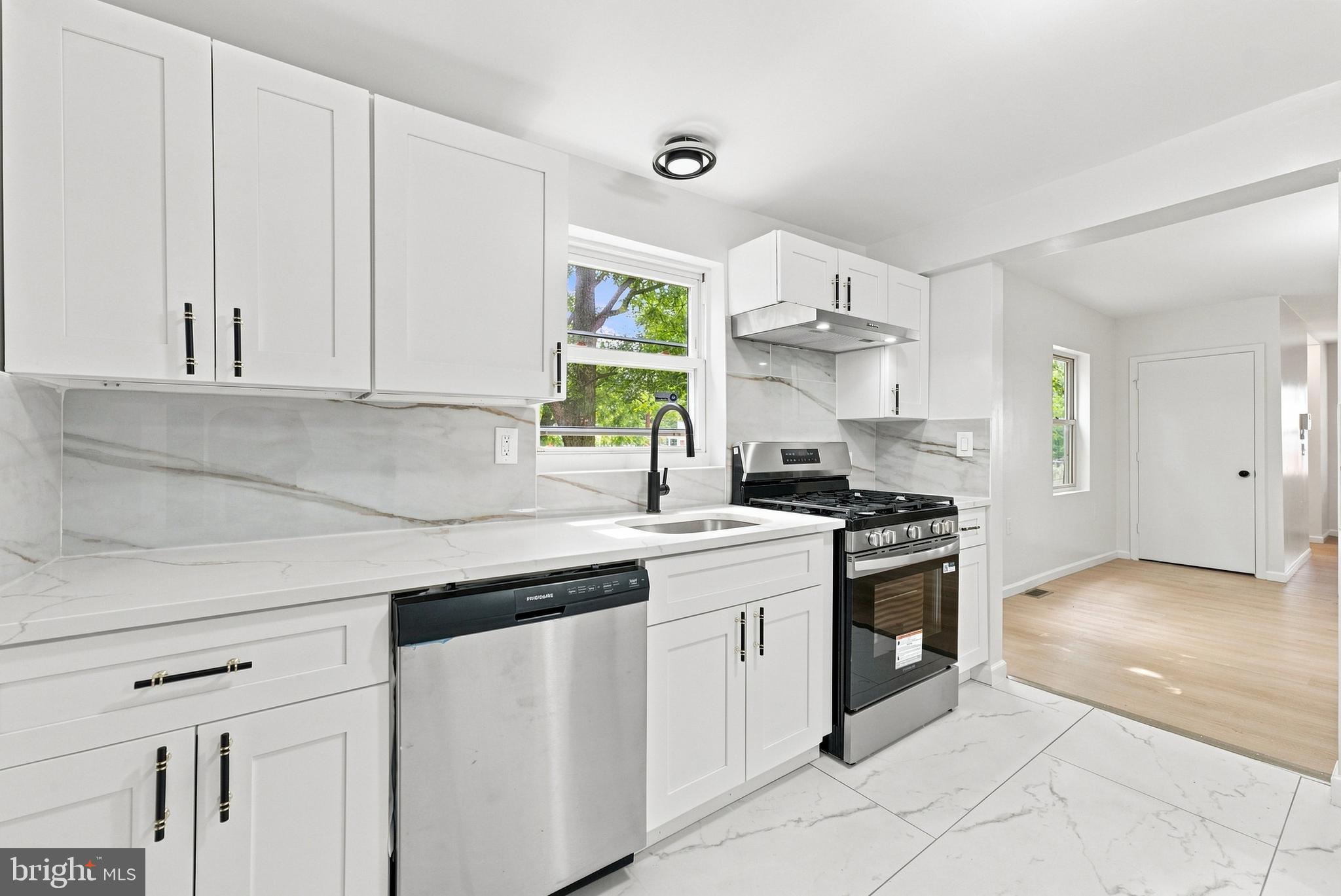 185 Rancocas Road Mount Holly, NJ 08060 - Photo 5 of 34 a kitchen with stainless steel appliances granite countertop a sink and a stove