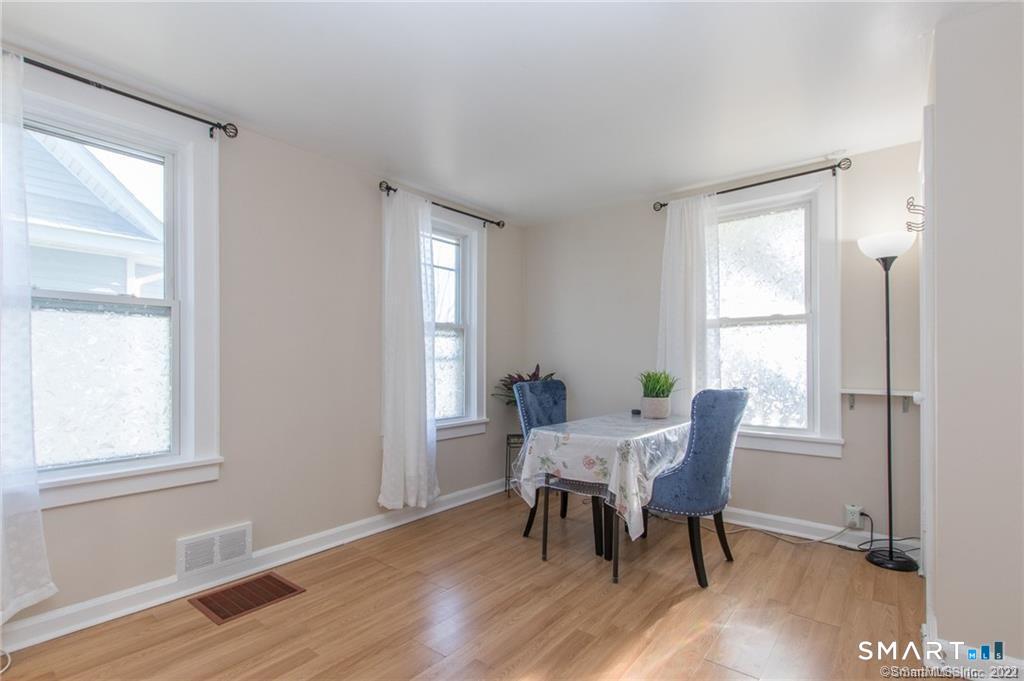18 Lawrence Street Norwalk, CT 06854 - Photo 10 of 31 a view of a dining room with furniture and a window