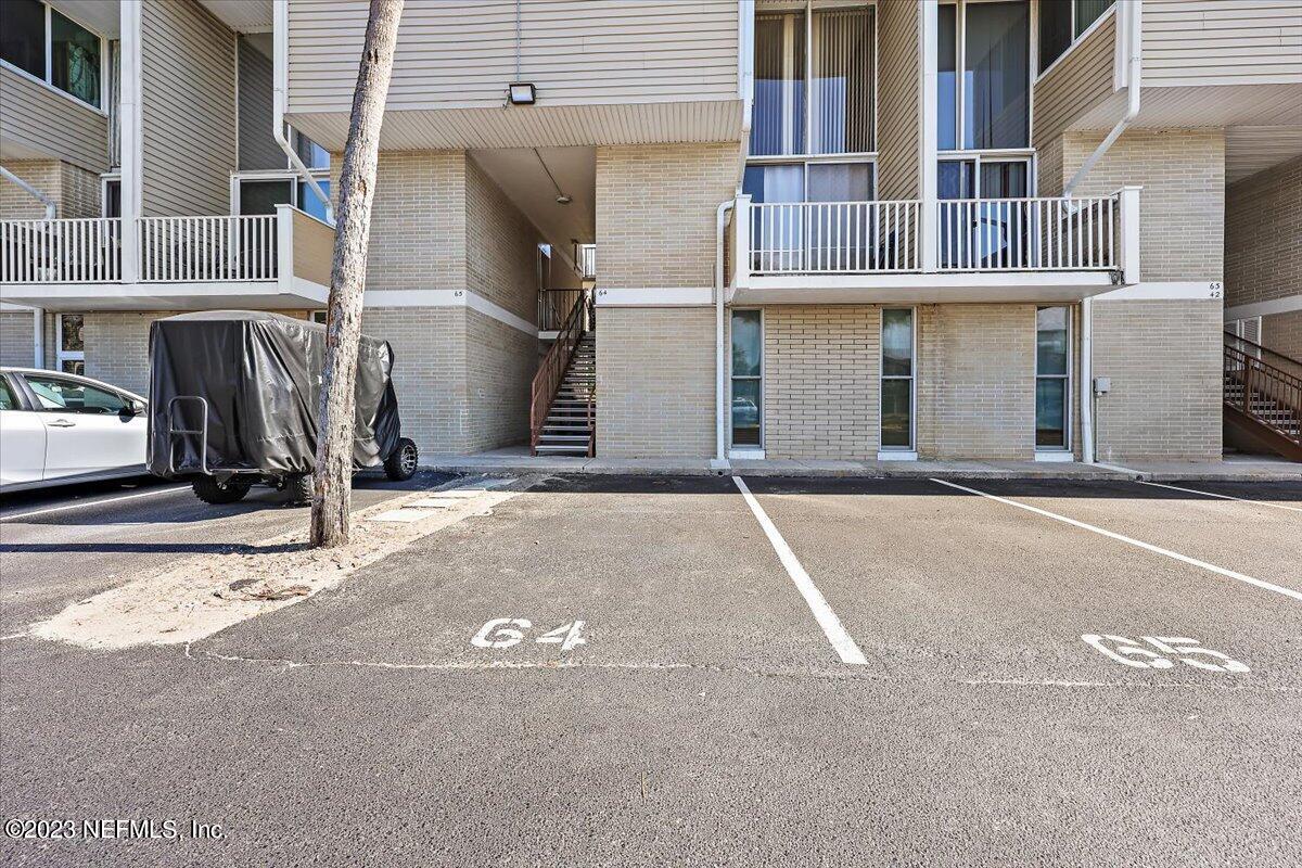 901 Ocean Boulevard, Unit 64 Atlantic Beach, FL 32233 - Photo 5 of 26 a view of parking space with large building