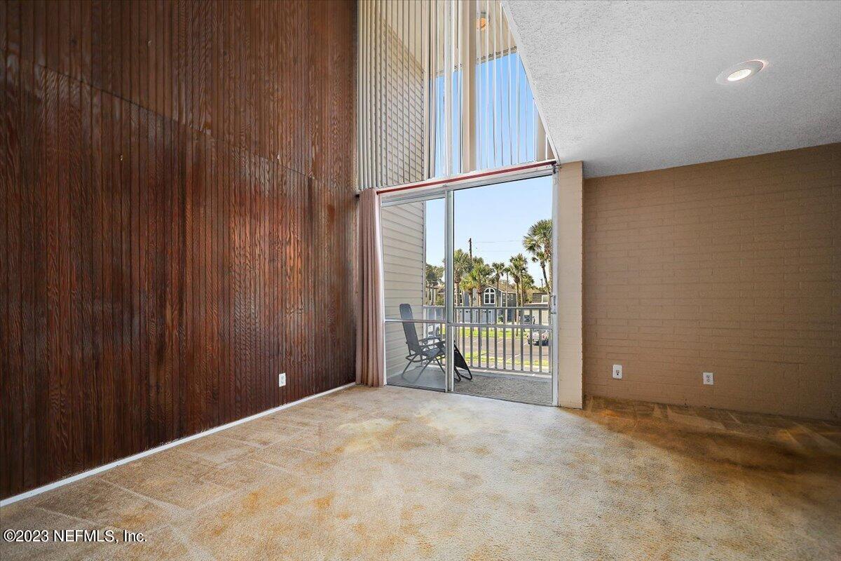 901 Ocean Boulevard, Unit 64 Atlantic Beach, FL 32233 - Photo 8 of 26 a view of a room with floor to ceiling window