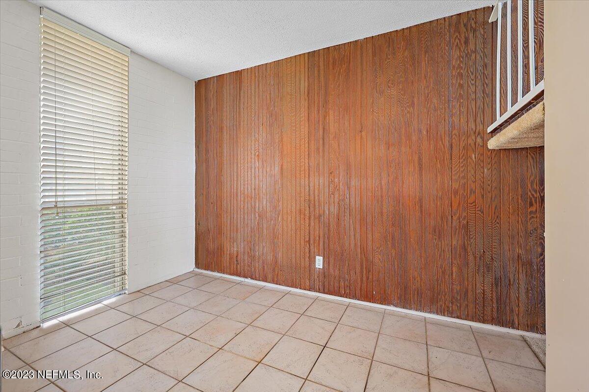 901 Ocean Boulevard, Unit 64 Atlantic Beach, FL 32233 - Photo 9 of 26 an empty room with windows