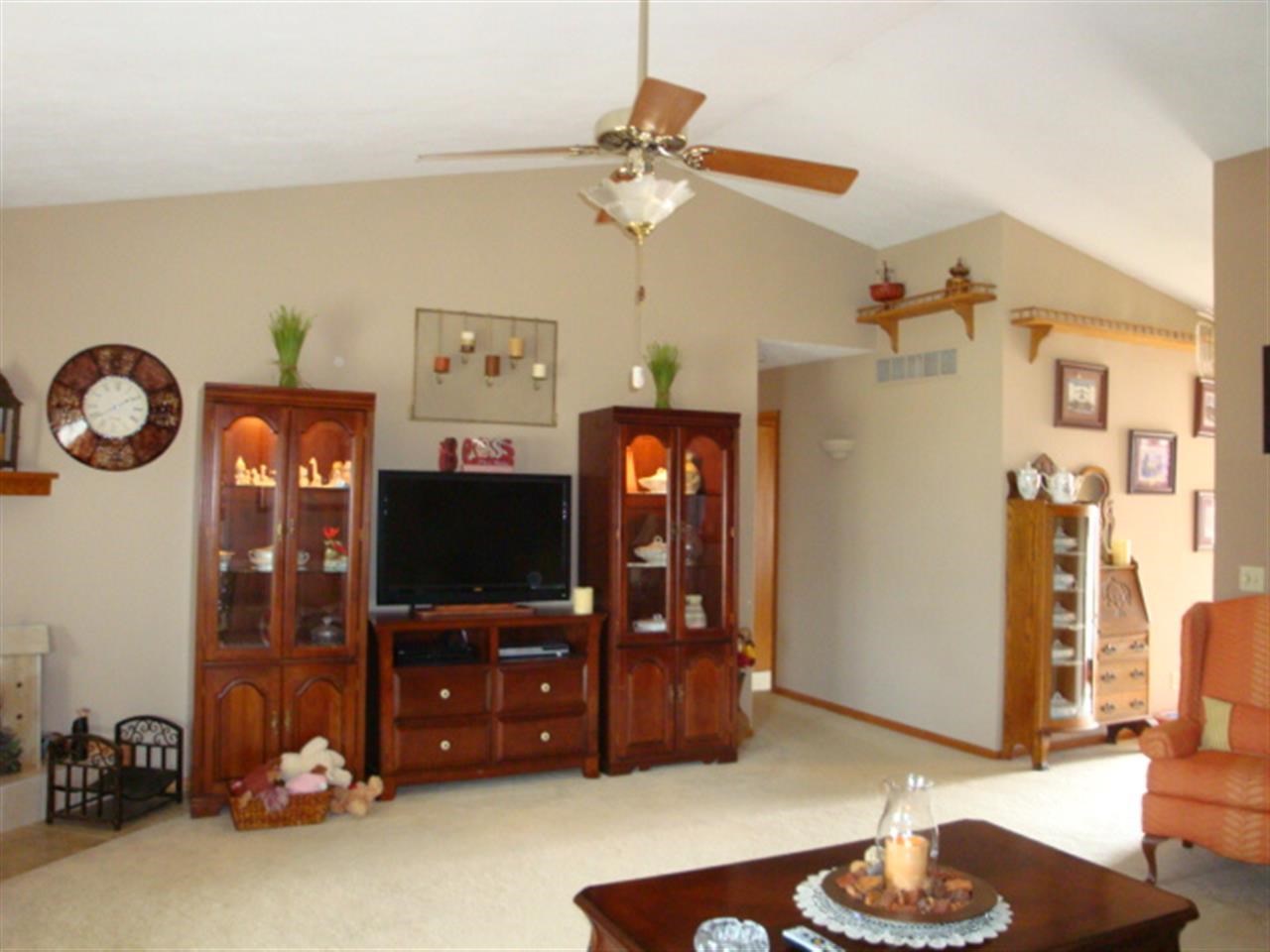6472 Cohoon Road Belvidere, IL 61008 - Photo 4 of 23 a living room with furniture and a flat screen tv