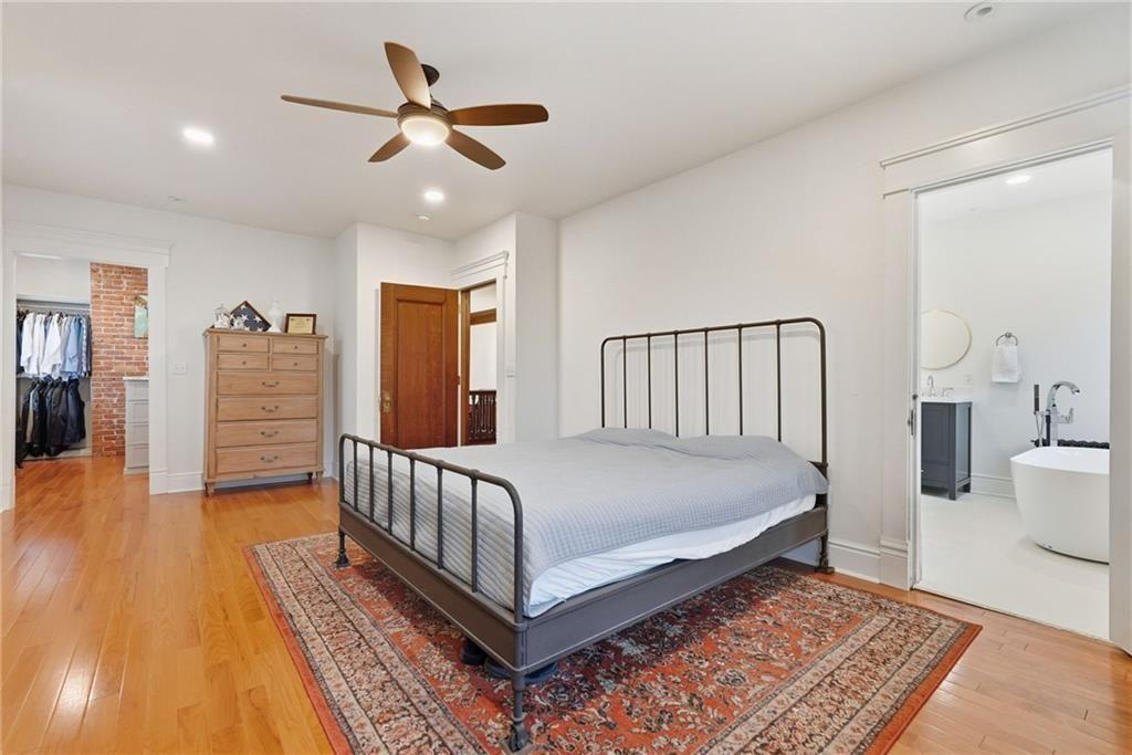 4749 Wallingford Street Pittsburgh, PA 15213 - Photo 28 of 49 a bed room with furniture and wooden floor