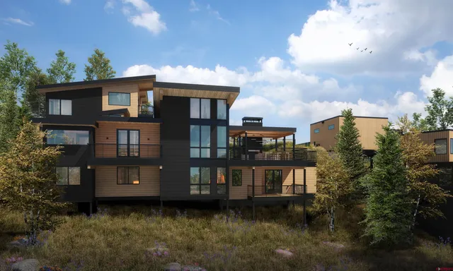 a kitchen with a stove a refrigerator a sink a dining table and chairs