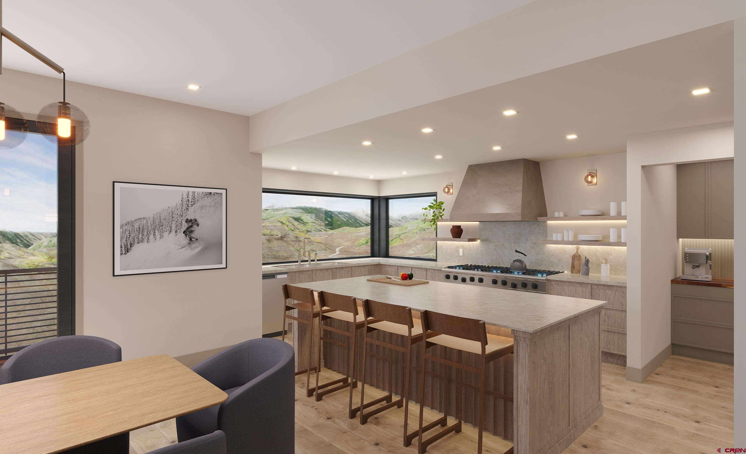 63 Cinnamon Mountain Road Crested Butte, CO 81225 - Photo 15 of 45 a kitchen with a stove a refrigerator a sink a dining table and chairs