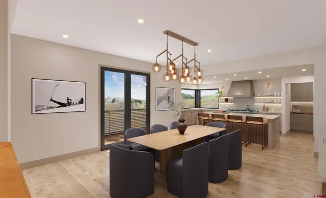 a living room with furniture a fireplace and floor to ceiling window