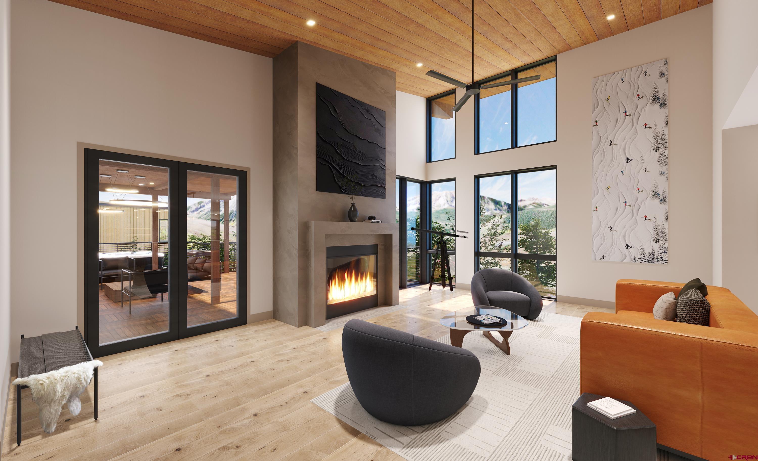 63 Cinnamon Mountain Road Crested Butte, CO 81225 - Photo 17 of 45 a living room with furniture a fireplace and floor to ceiling window