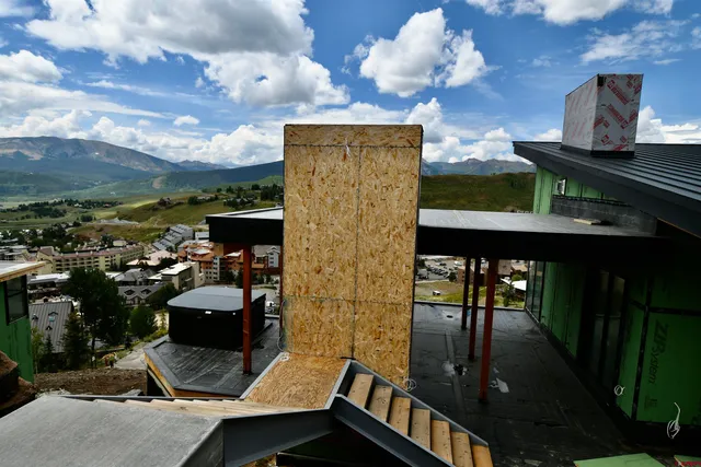 a kitchen with stainless steel appliances kitchen island a refrigerator and microwave