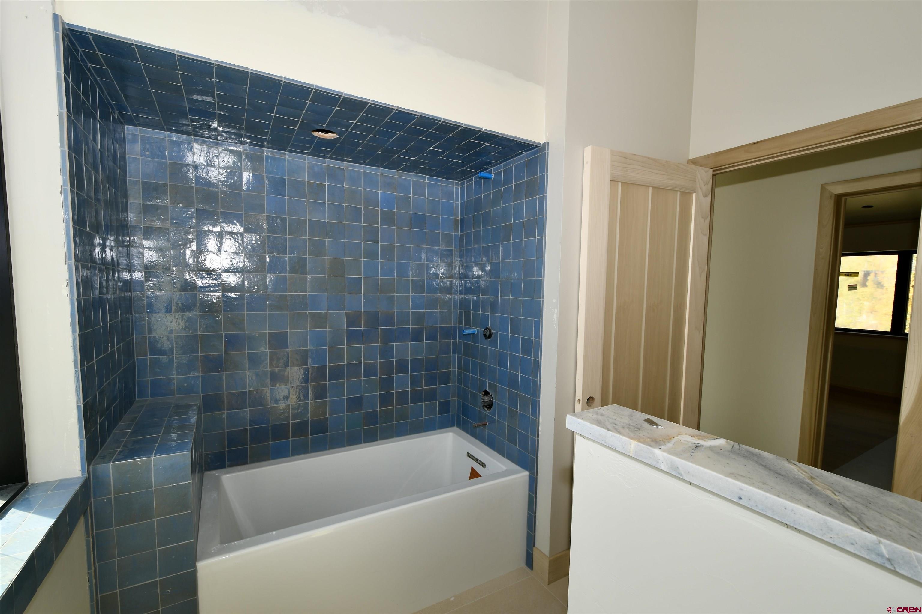 63 Cinnamon Mountain Road Crested Butte, CO 81225 - Photo 40 of 45 a bathroom with a bathtub