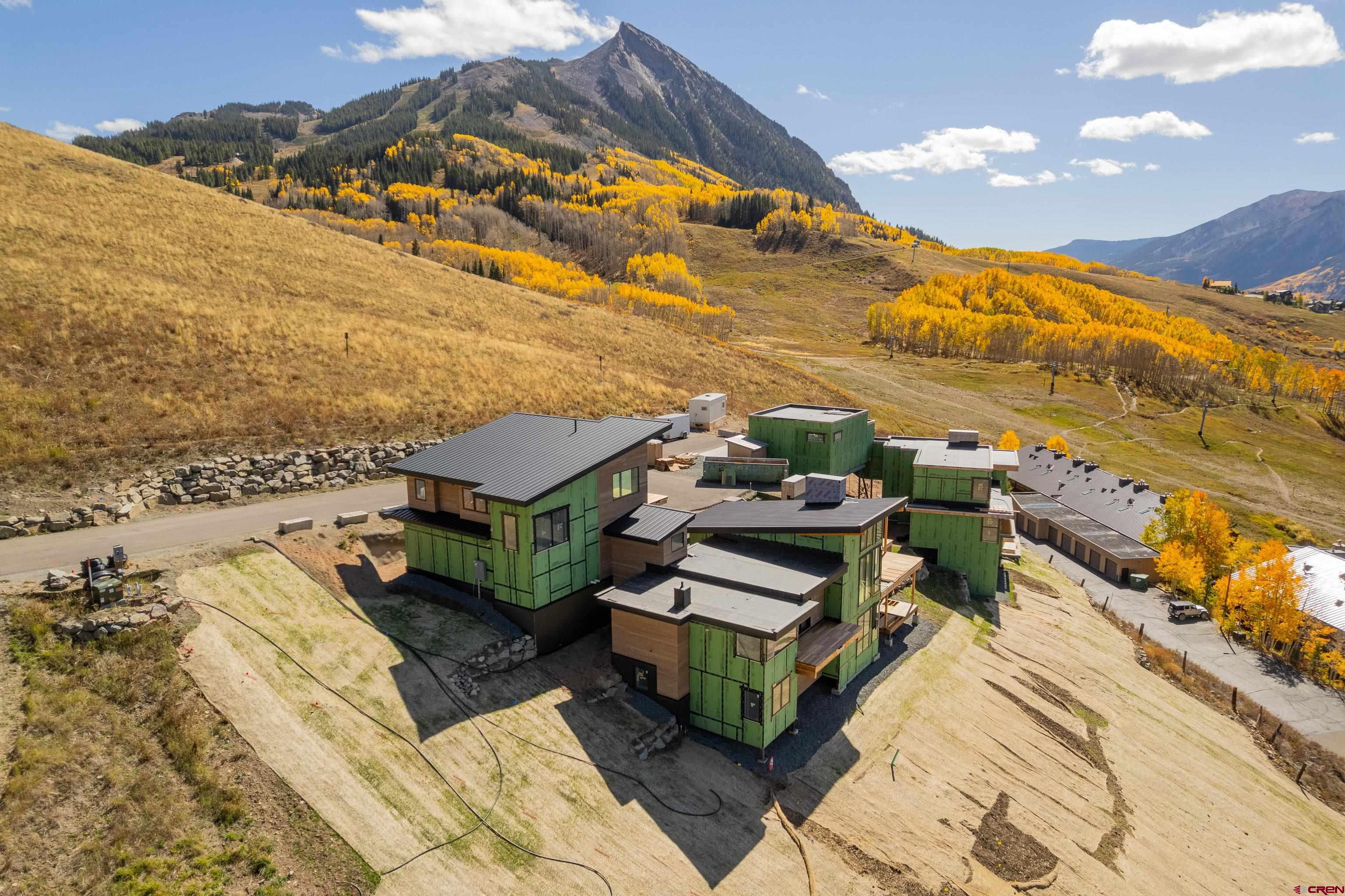 63 Cinnamon Mountain Road Crested Butte, CO 81225 - Photo 5 of 45 an aerial view of a house with a ocean view