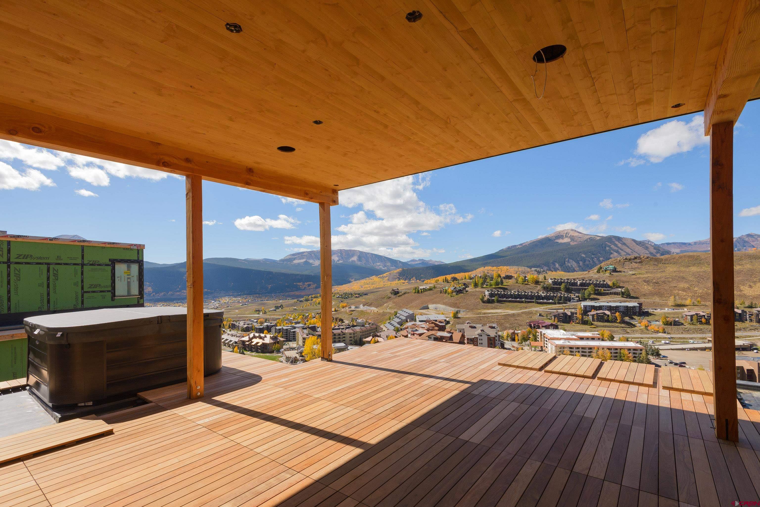 63 Cinnamon Mountain Road Crested Butte, CO 81225 - Photo 10 of 45 a view of a balcony with wooden floor