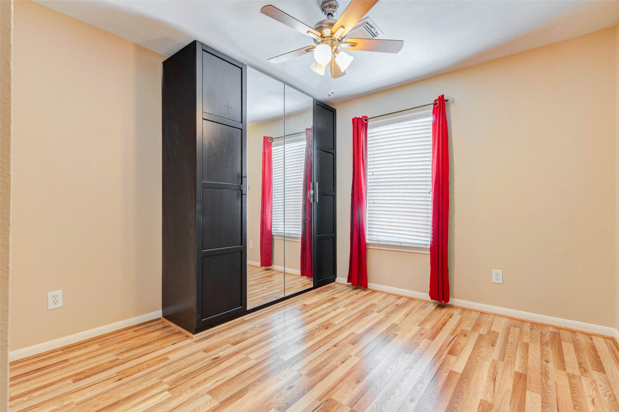 14522 Durham Chase Lane Houston, TX 77095 - Photo 19 of 40 a view of an empty room with wooden floor and a window
