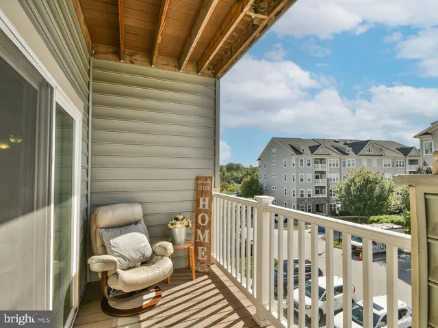 a bedroom with a bed and a lamp