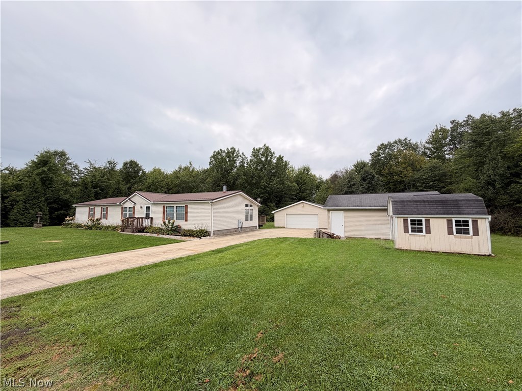 Front view of home with separate detached garage spaces